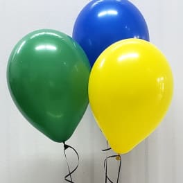 Three helium balloons in green, blue, and yellow with curling ribbons.