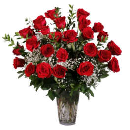 Bouquet of red roses with baby's breath in a clear glass vase