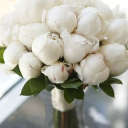 White peony bouquet in a glass vase