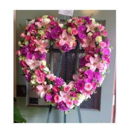 Heart-shaped floral wreath with pink and purple flowers