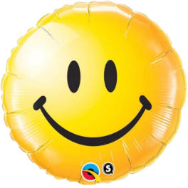 Yellow smiley face foil balloon on a white background