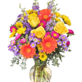 Colorful bouquet of mixed flowers in a glass vase
