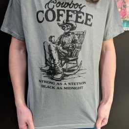 Person wearing a gray graphic T-shirt with a cowboy skeleton coffee print