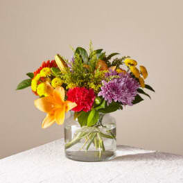 Colorful mixed bouquet in a clear glass vase