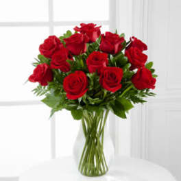 Bouquet of red roses in a clear glass vase