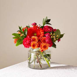 Bright mixed bouquet in a clear glass vase