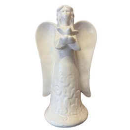 White ceramic angel figurine holding flowers