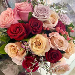 Bouquet of roses in pink, red, and cream tones