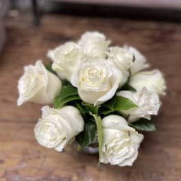 Bouquet of white roses with green leaves