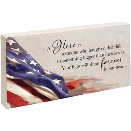 Decorative memorial plaque with an American flag design and tribute text