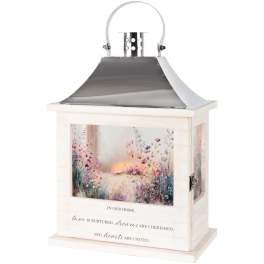 Decorative white lantern with floral artwork and a quote on the front
