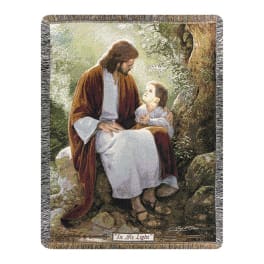 Woven blanket with a religious scene of Jesus and a child