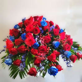 Large bouquet of red and blue roses with red accent flowers
