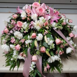 Large pink and white floral spray with ribbon accents