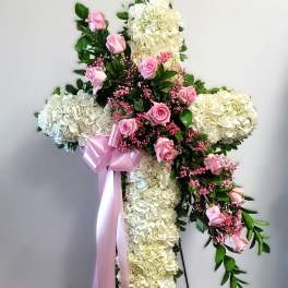 Cross-shaped floral standing spray with pink roses and white hydrangeas