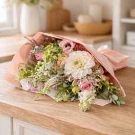 Pink and white mixed bouquet wrapped in blush paper