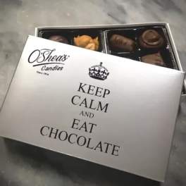 Box of assorted chocolates with a printed lid