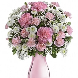 Pink and white bouquet in a pink glass vase