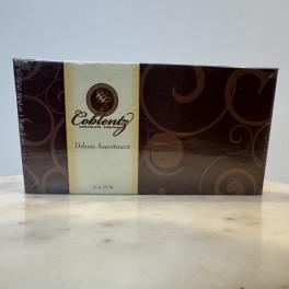 Box of deluxe assorted chocolates in brown and cream packaging