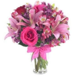 Pink bouquet with lilies and roses in a glass vase