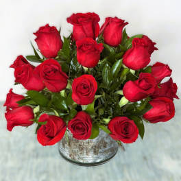 Bouquet of red roses in a rustic metal container