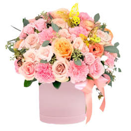 Pink and peach rose bouquet in a pink hatbox with ribbon