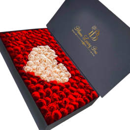 Box of red and cream roses arranged in a heart shape