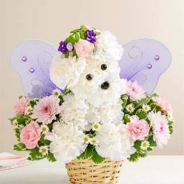 Basket arrangement shaped like a white puppy with pastel flowers and lavender fairy wings