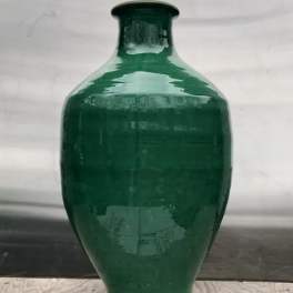 Green ceramic vase with a narrow neck and rounded body