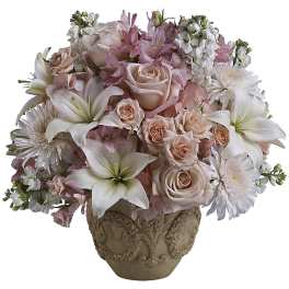 Pink and white floral arrangement in an ornate vase