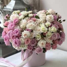 Pink and white rose bouquet in a round pink box with ribbon