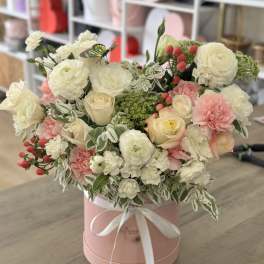 Pink hatbox arrangement with white and blush roses and carnations