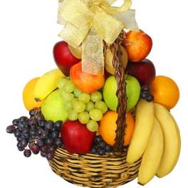 Fruit basket with bananas, grapes, apples, oranges, and a ribbon bow