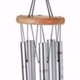 Hanging metal wind chime with a wooden top and oval tag