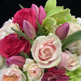 Bouquet of pink roses, tulips, and white hydrangeas