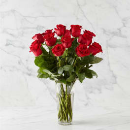 Bouquet of red roses in a clear glass vase