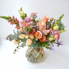 Mixed pastel bouquet in a clear glass vase