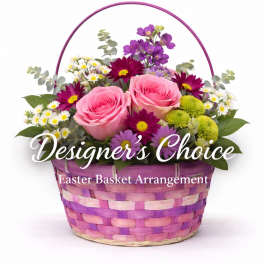 Pink roses and mixed daisies in a purple woven basket