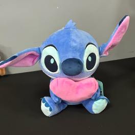 Blue and pink plush character toy with large ears and a heart