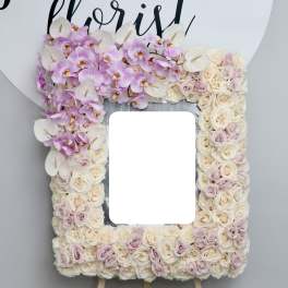 Floral standing frame with pink orchids, cream roses, and white anthuriums