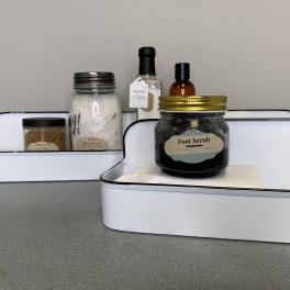 Gift trays with bath and body products in jars and bottles