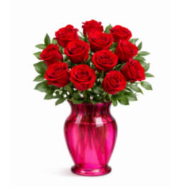 Red roses arranged in a pink glass vase