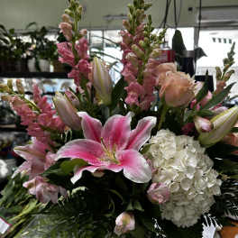 Pink lilies and white hydrangea in a mixed bouquet