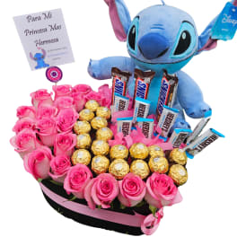 Pink rose arrangement with a Stitch plush and assorted chocolates