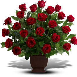Red roses arranged in a brown vase