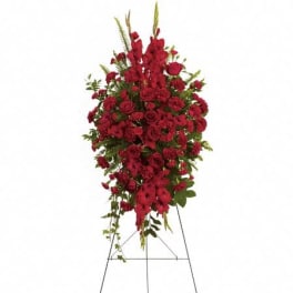 Tall red rose and carnation standing spray with snapdragons on a metal easel