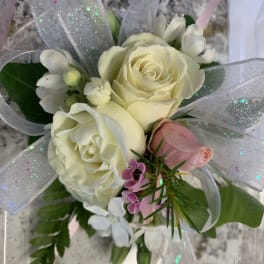 Small bouquet of white and pink roses with silver ribbon