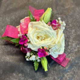 White rose boutonniere with pink accents and ribbon