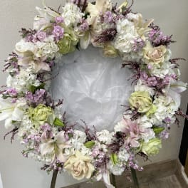 Heart-shaped floral wreath with white, blush, and lavender flowers