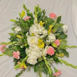Round bouquet of white roses, lilies, and pink carnations
